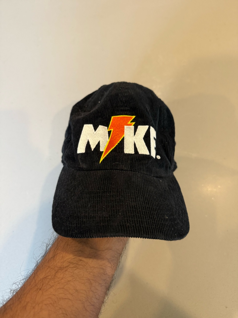 Jordan Black Corduroy Hat with White Logo and Red-Yellow Lightning